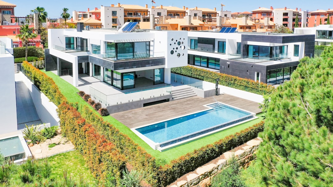 an aerial view of a house with a swimming pool